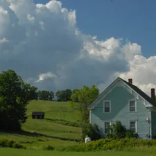 House on a hill related to Discover the Charm of Vermont's Cozy Bed and Breakfasts