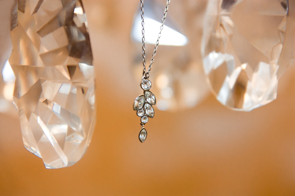 I was in my room trying to do my first product photo and the light was bad and I was desperate to have a beautiful result. I tried to create a lightbox without success. At one point, I just look around and focused on the Beauty that I saw and NOT on what I was missing… I saw this incredible chandelier with diamonds and I put the necklace on it! 
Jewels pictures are very difficult and I had to:
1. Change attitude and be positive and creative.
2. Realize that feeling is more important than thinking in photography.
3. Revise all basics of photography.
4. Know how to edit RAW files.
:) related to Delicate Light and Sophistication: The Charm of Bamboo Valance Curtains