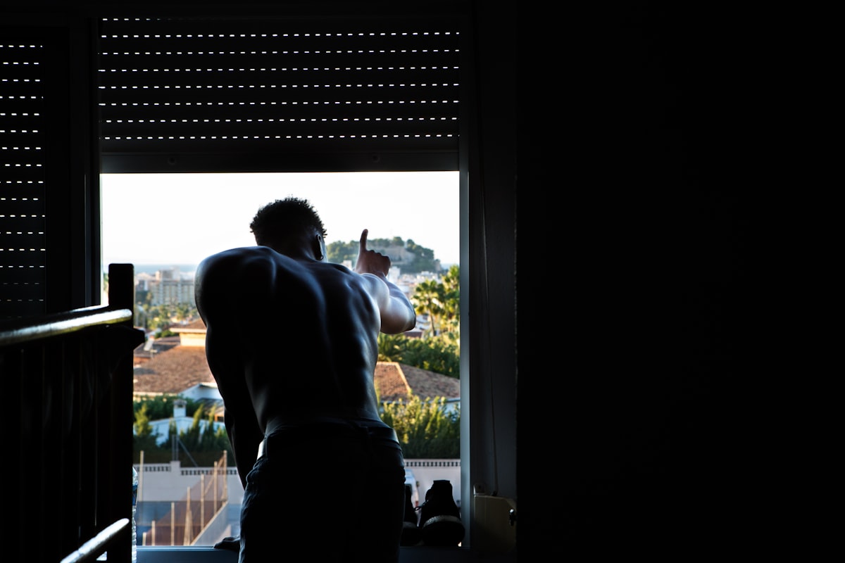 I was on a mission trip as a photographer with my universities basketball team in Spain. After one of our clinics with children from the community I was walking back to my room when I walked past and saw this individual hanging out the window, and had to get this shot. I told him to not move while I got my settings right, and it quickly became one of my favorite images from the trip. related to Elevate Your Window Game: A Guide to Valances