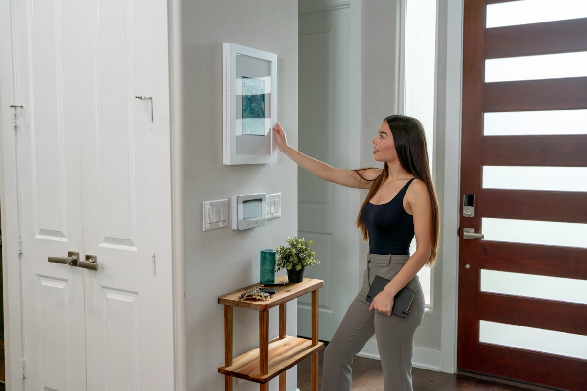 Intriguing Art Piece by Sable Flow. Join a girl in a black shirt as she explores a secret whiteboard that's also an art piece in her cozy white-painted home. related to Elevate Your Space: Board Mounted Valance Ideas