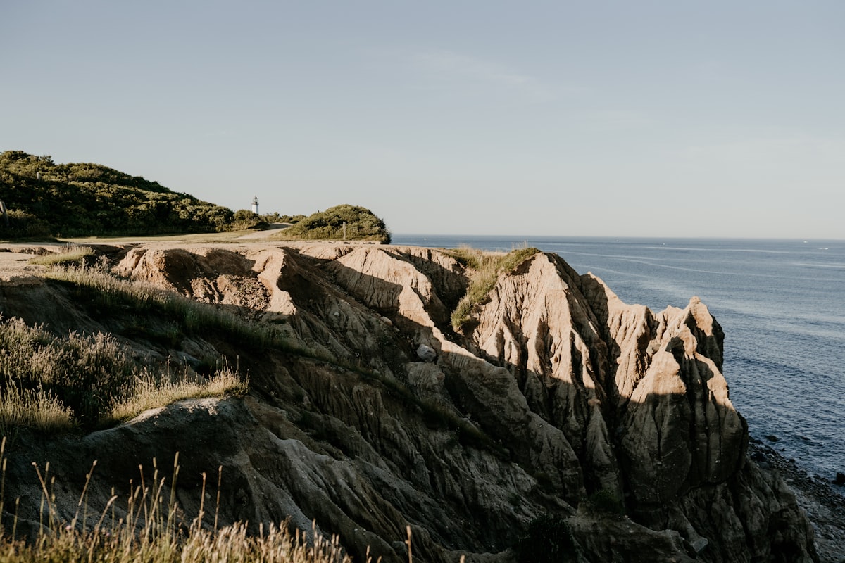 landscape photo of mountains near ocean during daytime related to Discover the Best Stays in Montauk