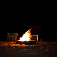 Lighting up a fire in the middle of the Adrar desert. related to Mending the Art of Outdoor Fire: Repairing Cracked Chimineas