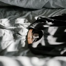 Linen dress on hanger related to The Ultimate Guide to Bed in a Bag Essentials