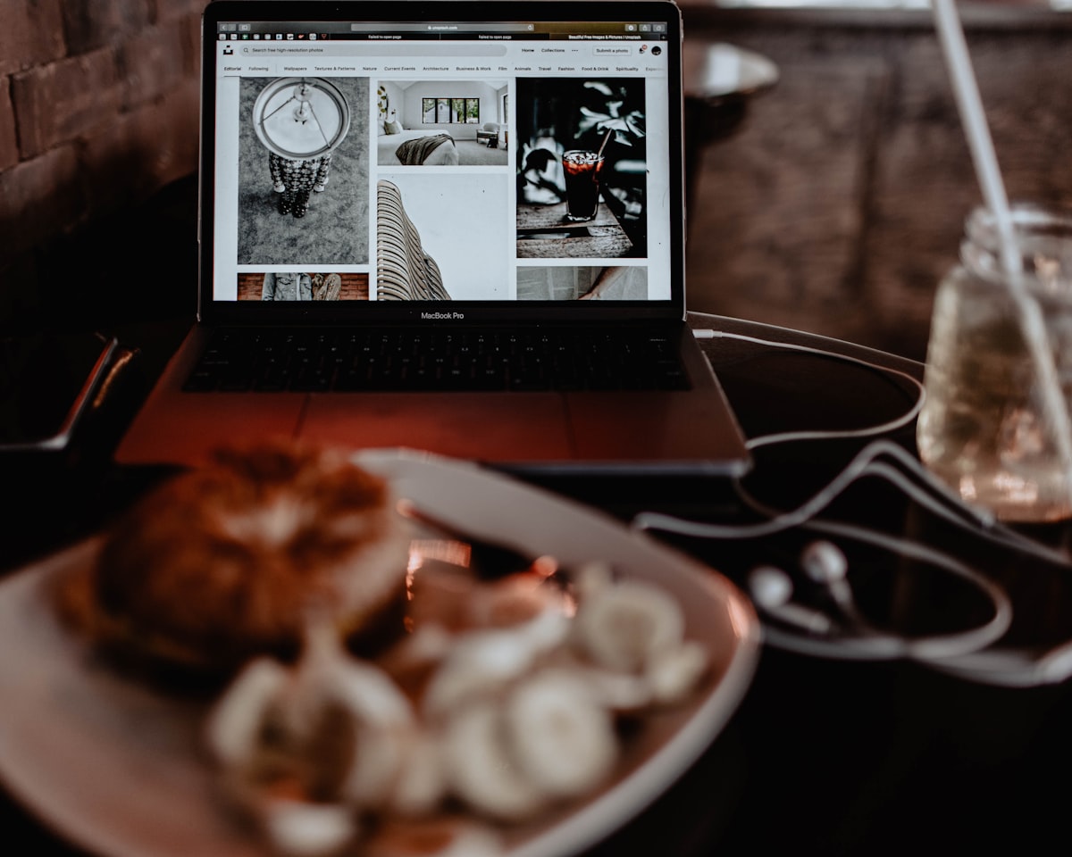 MacBook Pro on table related to Elevating the Bed and Breakfast Experience Online