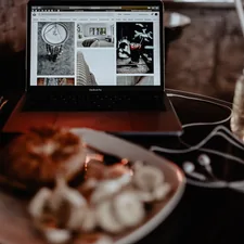 MacBook Pro on table related to Elevating the Bed and Breakfast Experience Online