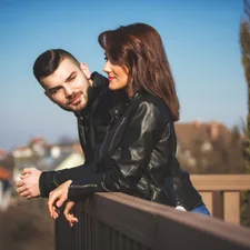 Man looking at women, both smiling. related to Stay Up to Date with Trend-Savvy Insights