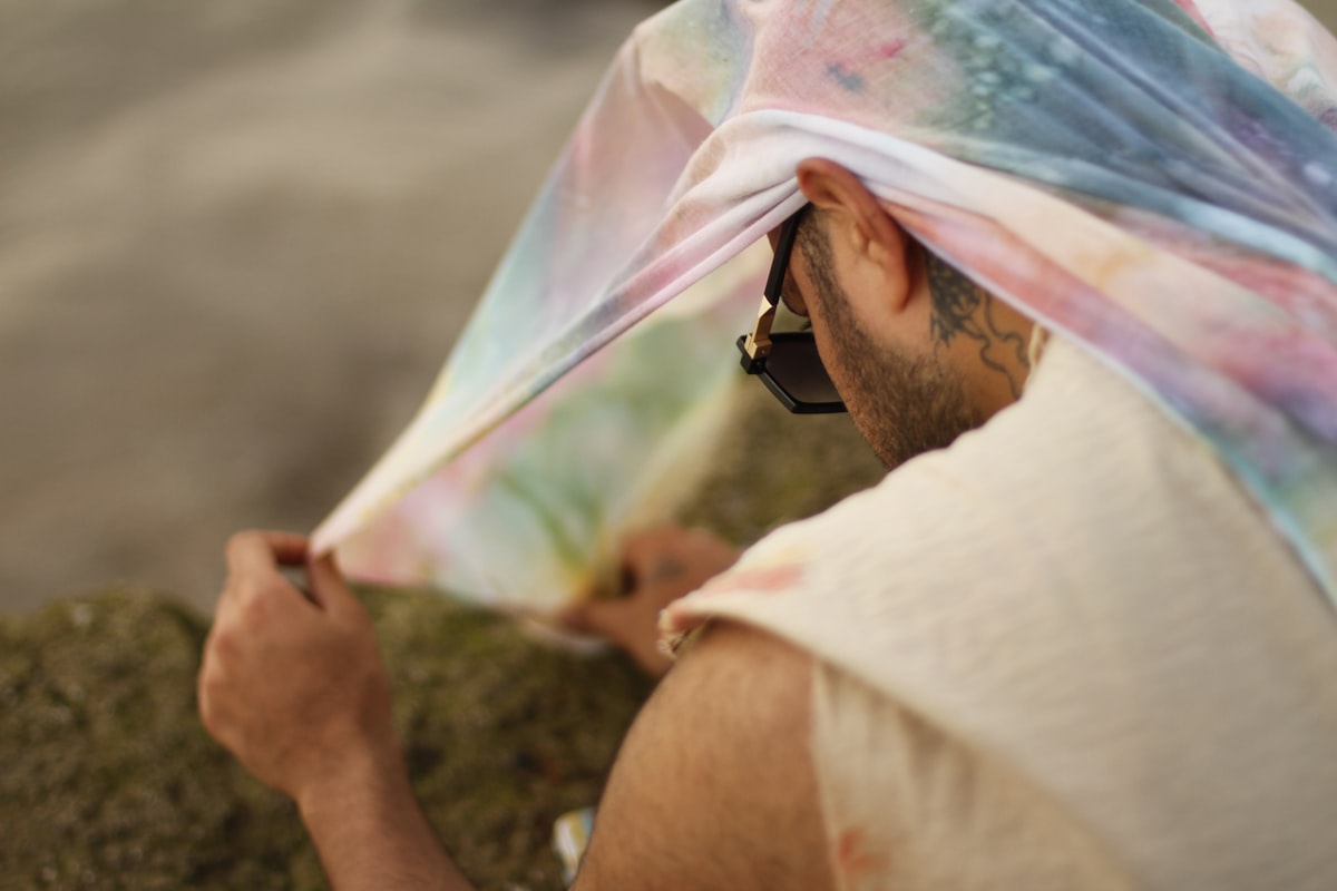 man wearing sunglasse related to 10 Creative Scarf Valance Ideas to Elevate Your Window Style