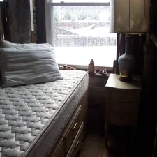 mattress and night stand in front of window related to Queen Size Coverlets - Shop Now!