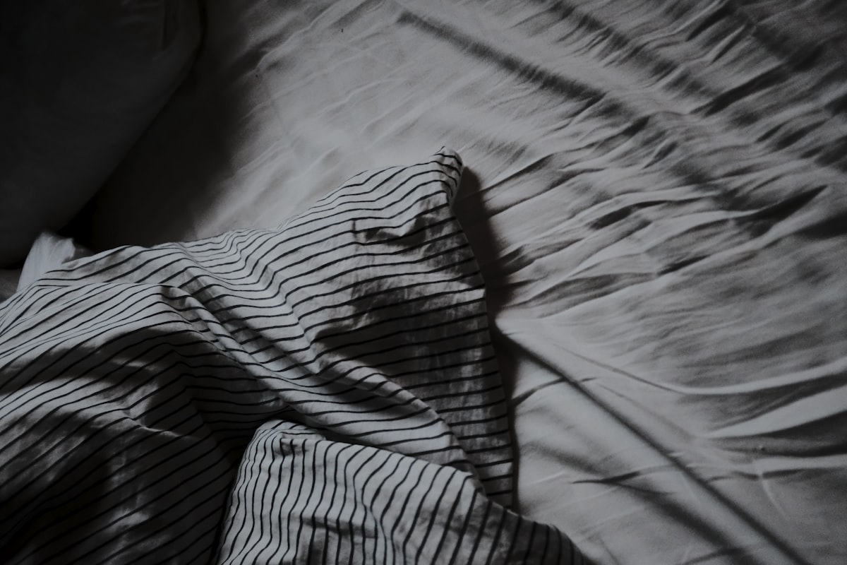 Messy bed related to Black and White Coverlet: The Perfect Blend of Elegance