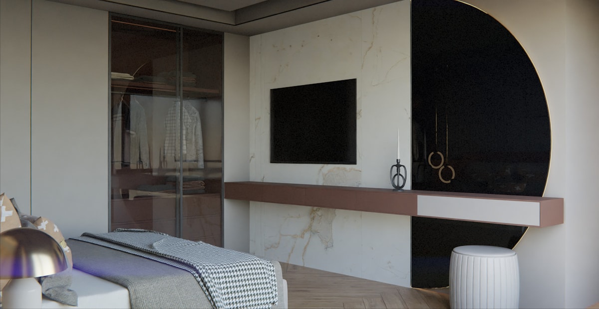 Modern bedroom with closet and wall-mounted television. related to Elevate Your Space with These Innovative Floor Bed Ideas
