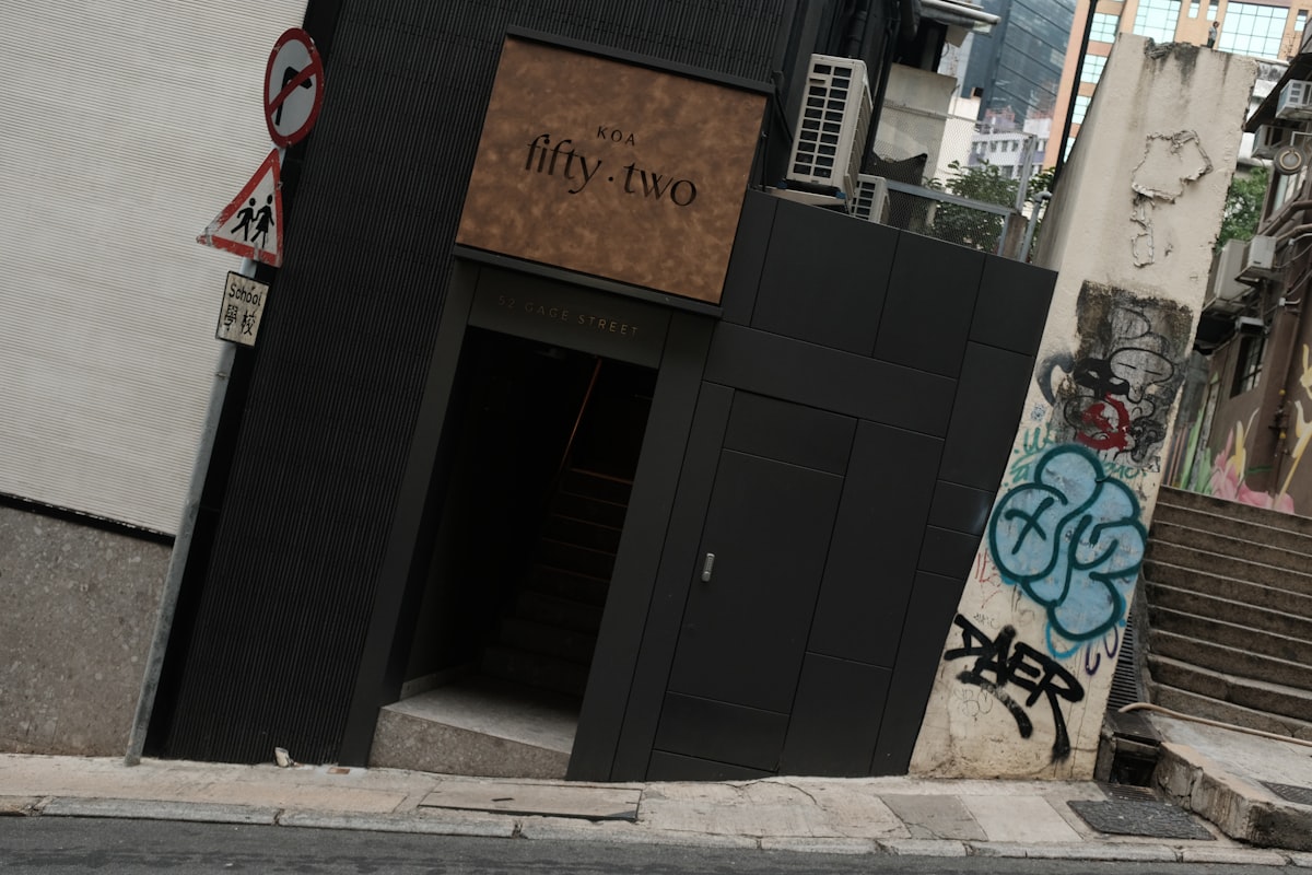 Modern building entrance with graffiti on wall related to Creating a Stunning Artwork for Your Entryway