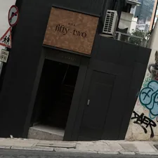Modern building entrance with graffiti on wall related to Creating a Stunning Artwork for Your Entryway