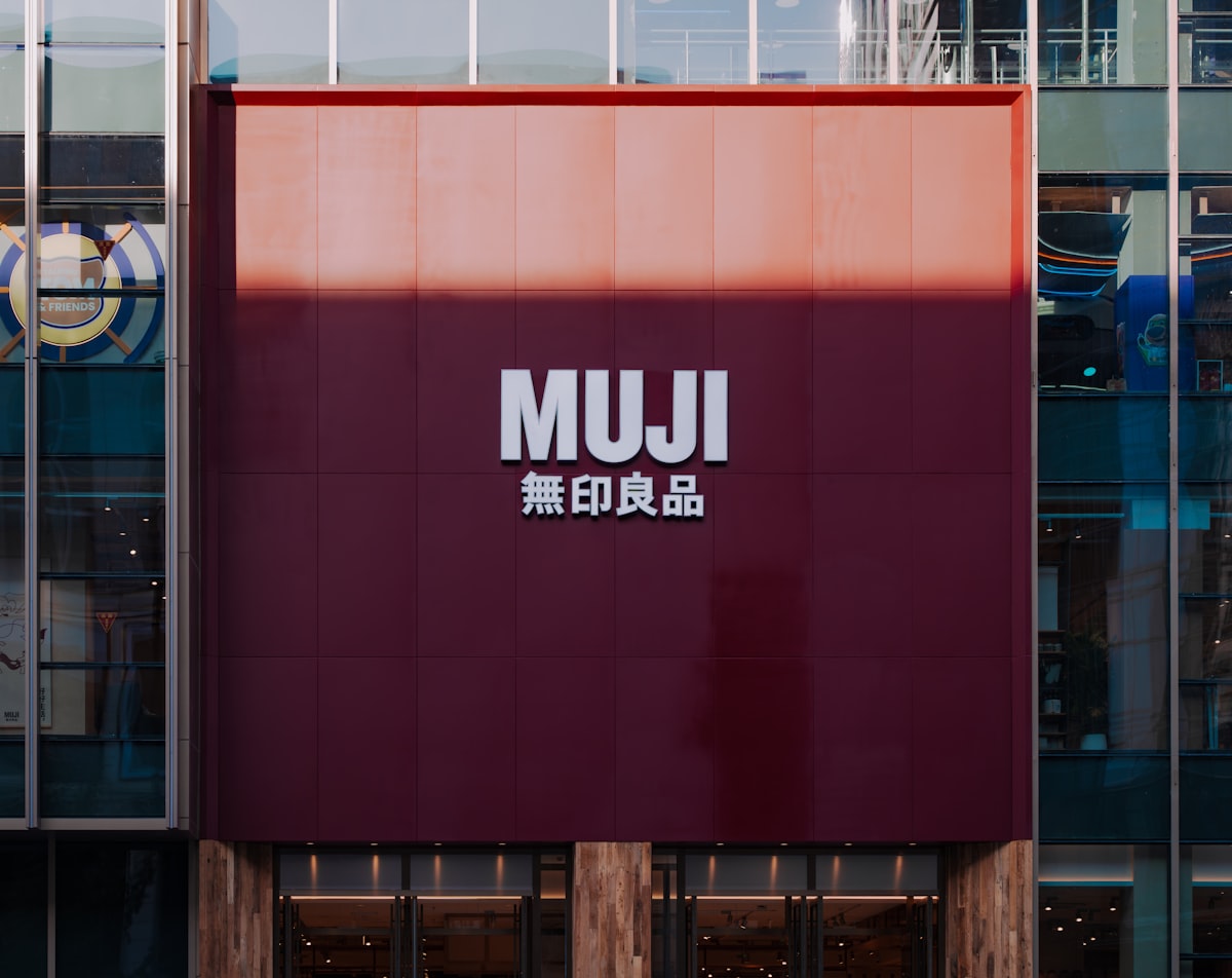 Muji store facade with large red sign related to Minimalist Sleep Solutions for Every Bedroom