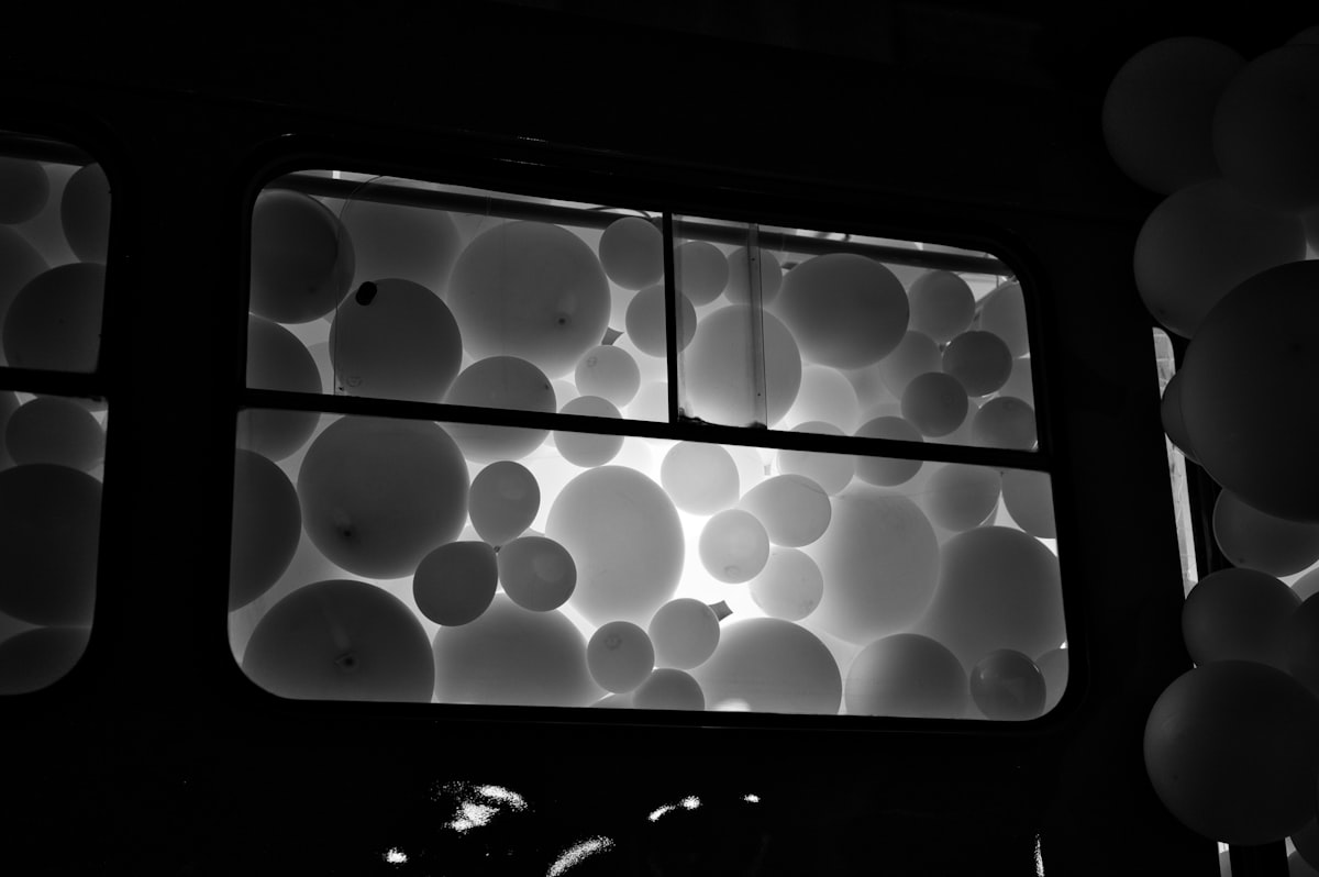 Multiple balloons lighten with some background light inside the tram related to Balloon Window Valance: A Comprehensive Guide