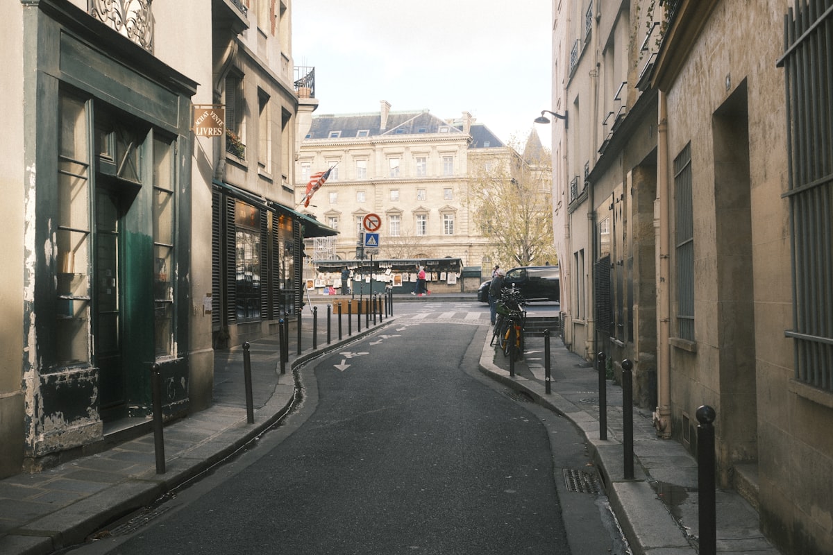Narrow european street with buildings and distant architecture. related to Discover the Charm of the Raleigh Bed