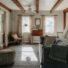 Neutral tone living room (IG: @clay.banks) related to Living Room Valance Guide