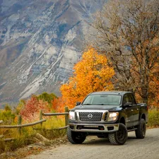 Nissan Titan in front of Mount Timpanogos in Utah related to Optimizing Cargo Space: Unveiling the Nissan Frontier Bed Dimensions