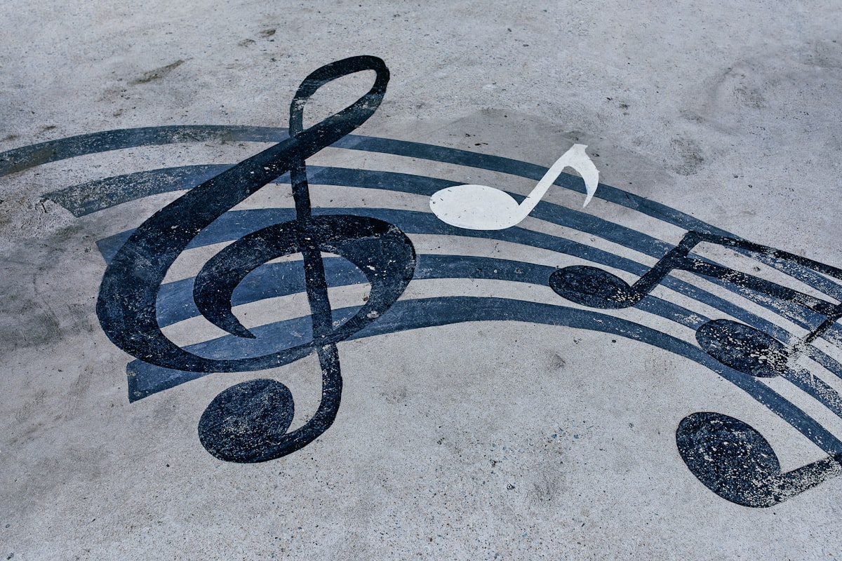 Notes drawn on a muddy road. Horizontal background with musical notes related to Transform Your Bedroom with Music Note Bedding