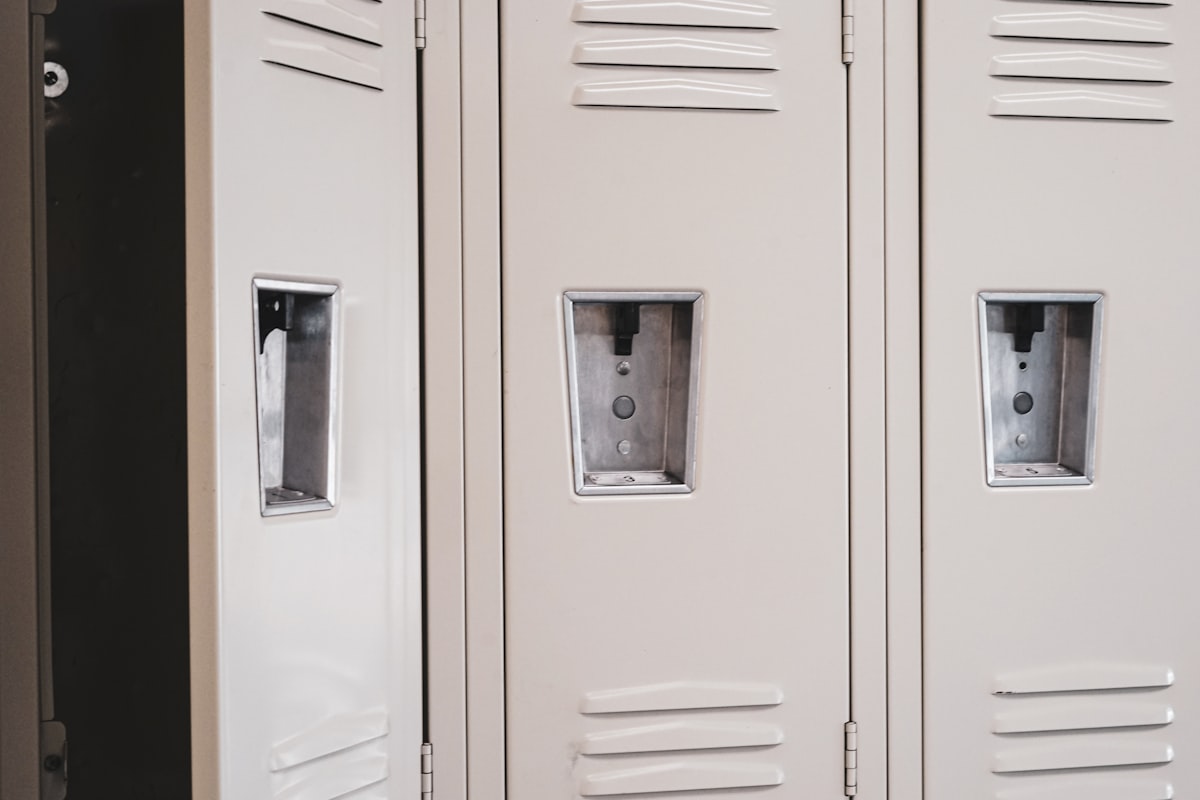 One open locker in a hallway. related to Transform Your Entryway with Stylish and Functional Storage Locker Furniture