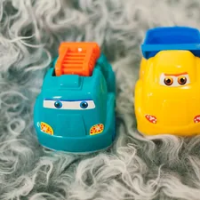 orange and black plastic toy related to Cars Toddler Beds