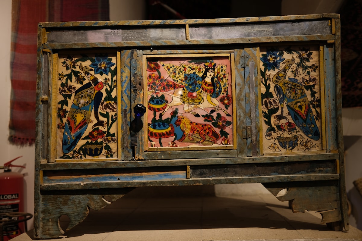 Ornate antique chest with colorful painted panels related to Spanish Revival Sideboard: A Timeless Treasure in Home Furnishing