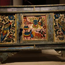 Ornate antique chest with colorful painted panels related to Spanish Revival Sideboard: A Timeless Treasure in Home Furnishing