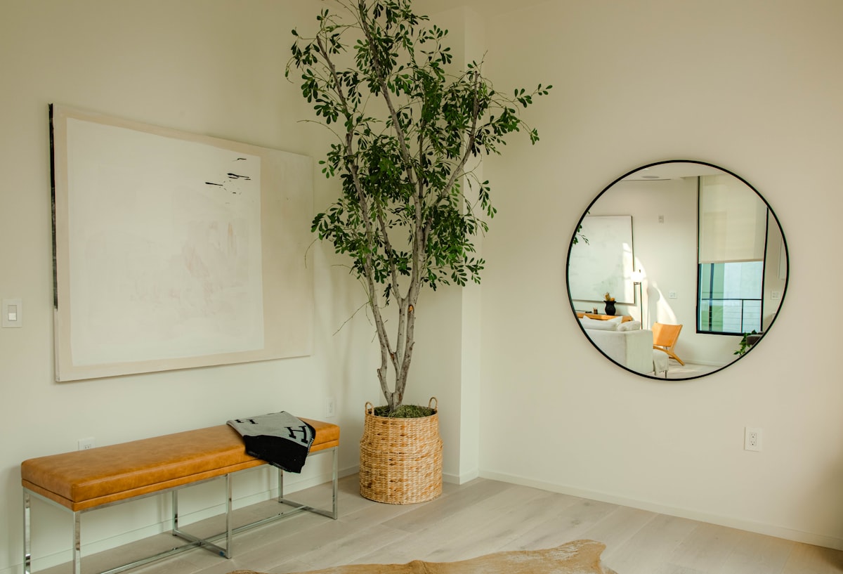 oval mirror with brown wooden frame related to Elevate Your Entryway with Style
