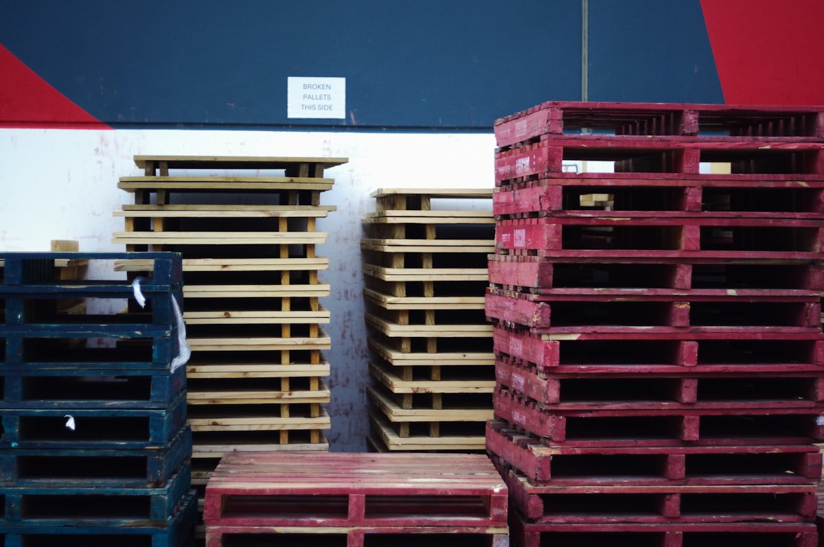 Pallets of contrasting colours related to Rustic Bed Makers: Transforming Pallets into Cozy Sleeping Spaces