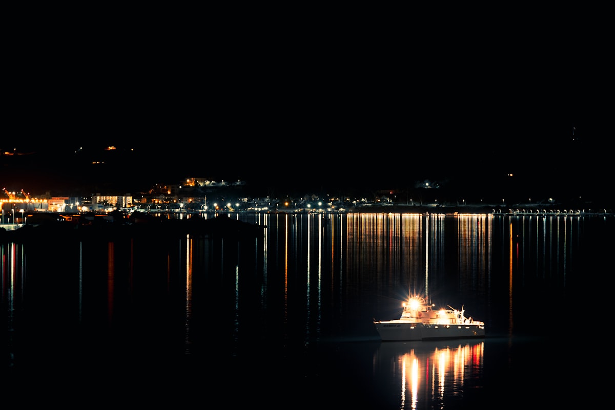 Patrol Ship Navigating San Diego Bay at Night related to Elegant Nights: Explore the Best Navy Blue Coverlets for Your Queen-Size Bed