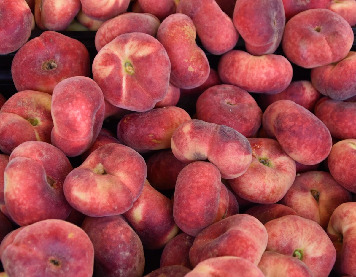 Peach fruits on a market stand of a fruit market 
 related to The Ultimate Guide to Choosing a Peach Bed Set for a Cozy Bedroom
