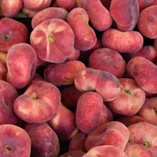 Peach fruits on a market stand of a fruit market 
 related to The Ultimate Guide to Choosing a Peach Bed Set for a Cozy Bedroom