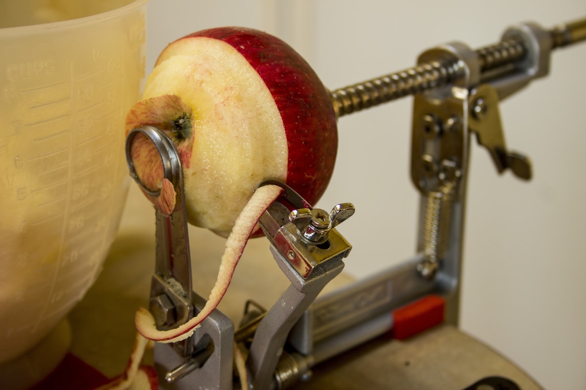 Peeling and coring apples for making apple pies and apple treats in the fall. Fesh picked apples related to Apple Valances in the Kitchen: A Juicy Twist for All