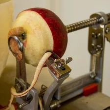 Peeling and coring apples for making apple pies and apple treats in the fall. Fesh picked apples related to Apple Valances in the Kitchen: A Juicy Twist for All