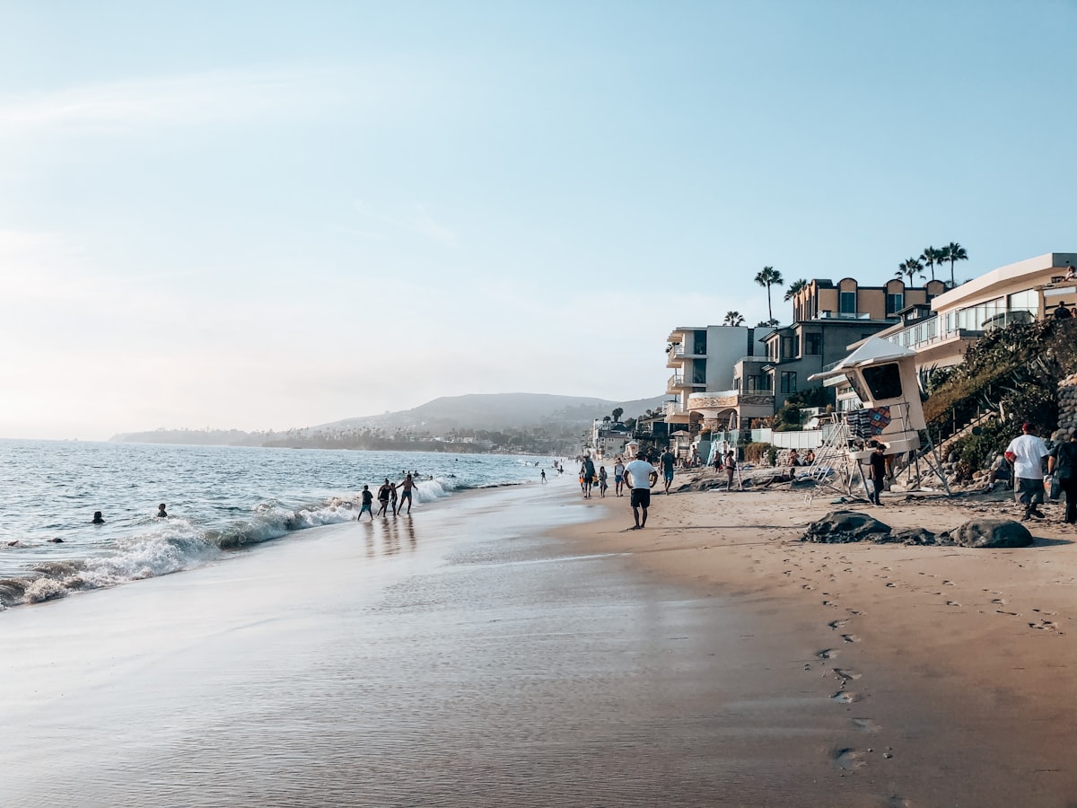 people on beach during daytime related to Paradise Found: Your Ultimate Guide to Laguna Beach Bed and Breakfast