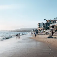 people on beach during daytime related to Paradise Found: Your Ultimate Guide to Laguna Beach Bed and Breakfast