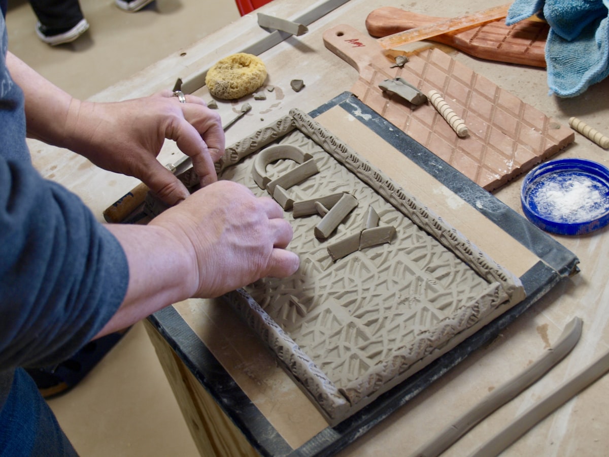 person doing cay related to Cozy Up with Style: Discover the Best Clay Chimineas at Home Depot
