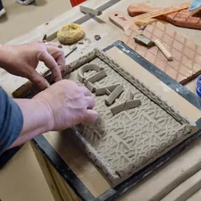 person doing cay related to Cozy Up with Style: Discover the Best Clay Chimineas at Home Depot