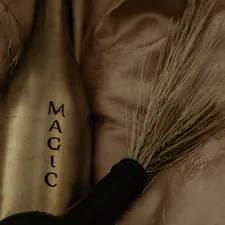 person holding black and brown hand tool related to Unravel the Magic of Candice Olson Bedding