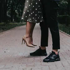 person in black and white polka dot dress related to Stay Up to Date with Trend-Savvy Insights