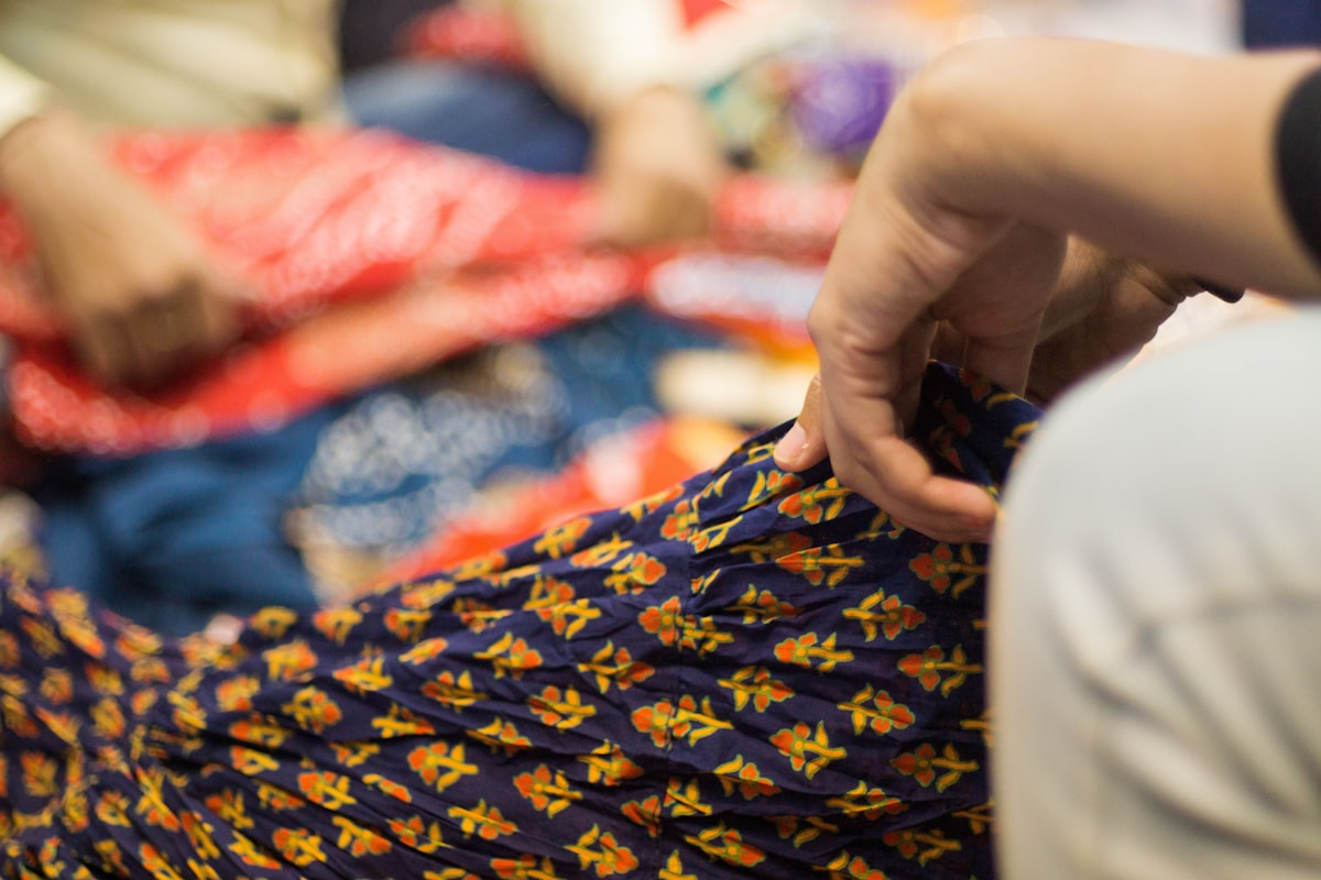 person in blue and yellow dress related to Transform Your Bedroom with Indian-Inspired Bedding