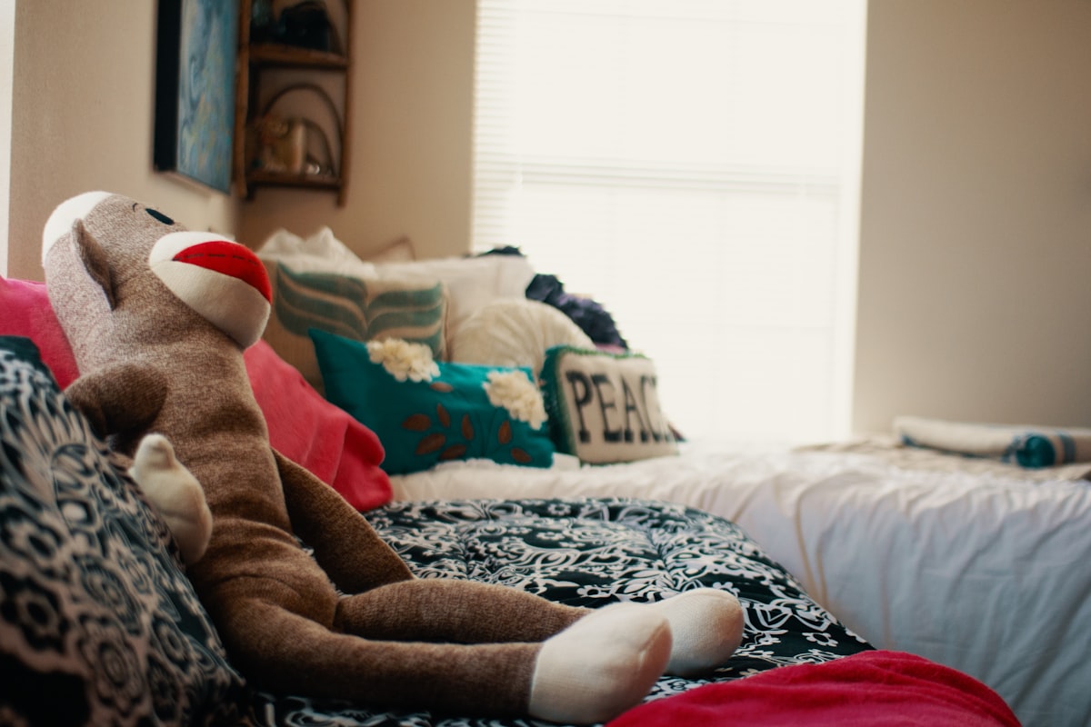 person in brown and white pants lying on bed related to Ultimate Comfort with a Giant Plush Bed
