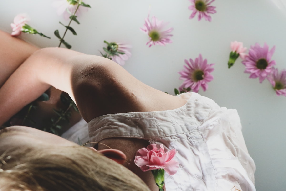 person in white and pink floral shorts lying on bed related to Unlocking Savings with Bed Bath and Beyond Coupons