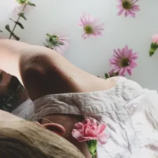 person in white and pink floral shorts lying on bed related to Unlocking Savings with Bed Bath and Beyond Coupons