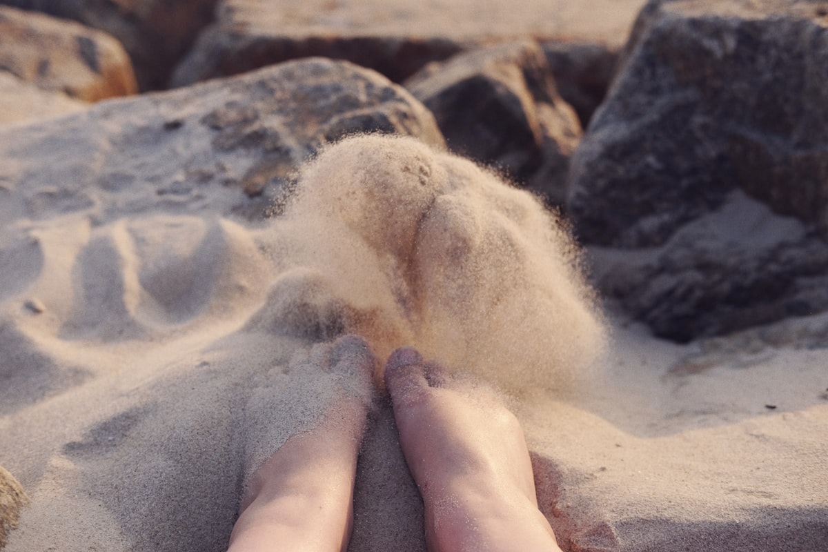 person's feet on sand related to Cozy Up with Sand for Your Chiminea