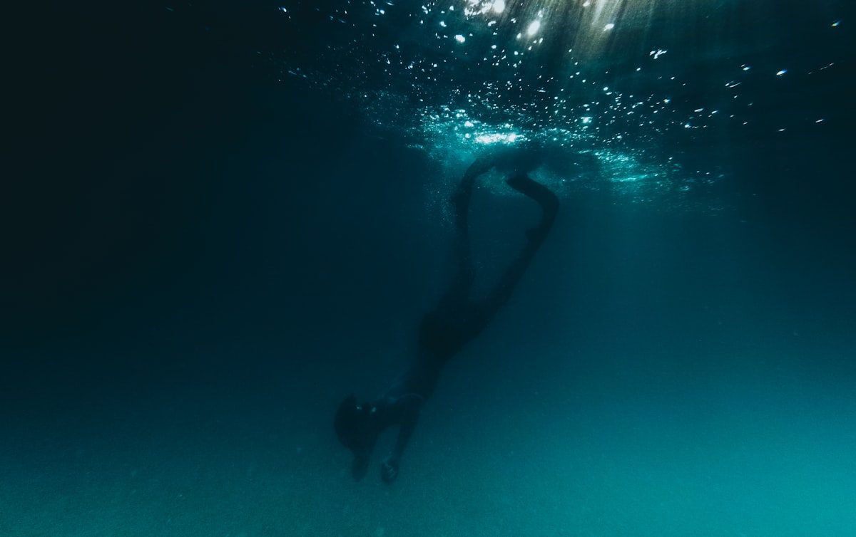 person underwater photo related to Reviving the Classics: A Deep Dive into the BMW E28 Front Valance