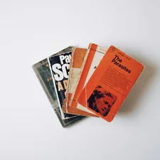 Pile of books on a white background. related to The Ultimate Guide to Covers for Truck Beds
