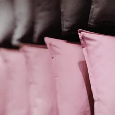 pink textile on brown textile related to Sweet Dreams in the Dark: A Guide to Black and Pink Crib Bedding