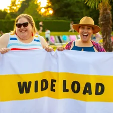 Plus size women at a pool party related to The Ultimate Guide to Double Bed Sizes: Everything You Need to Know