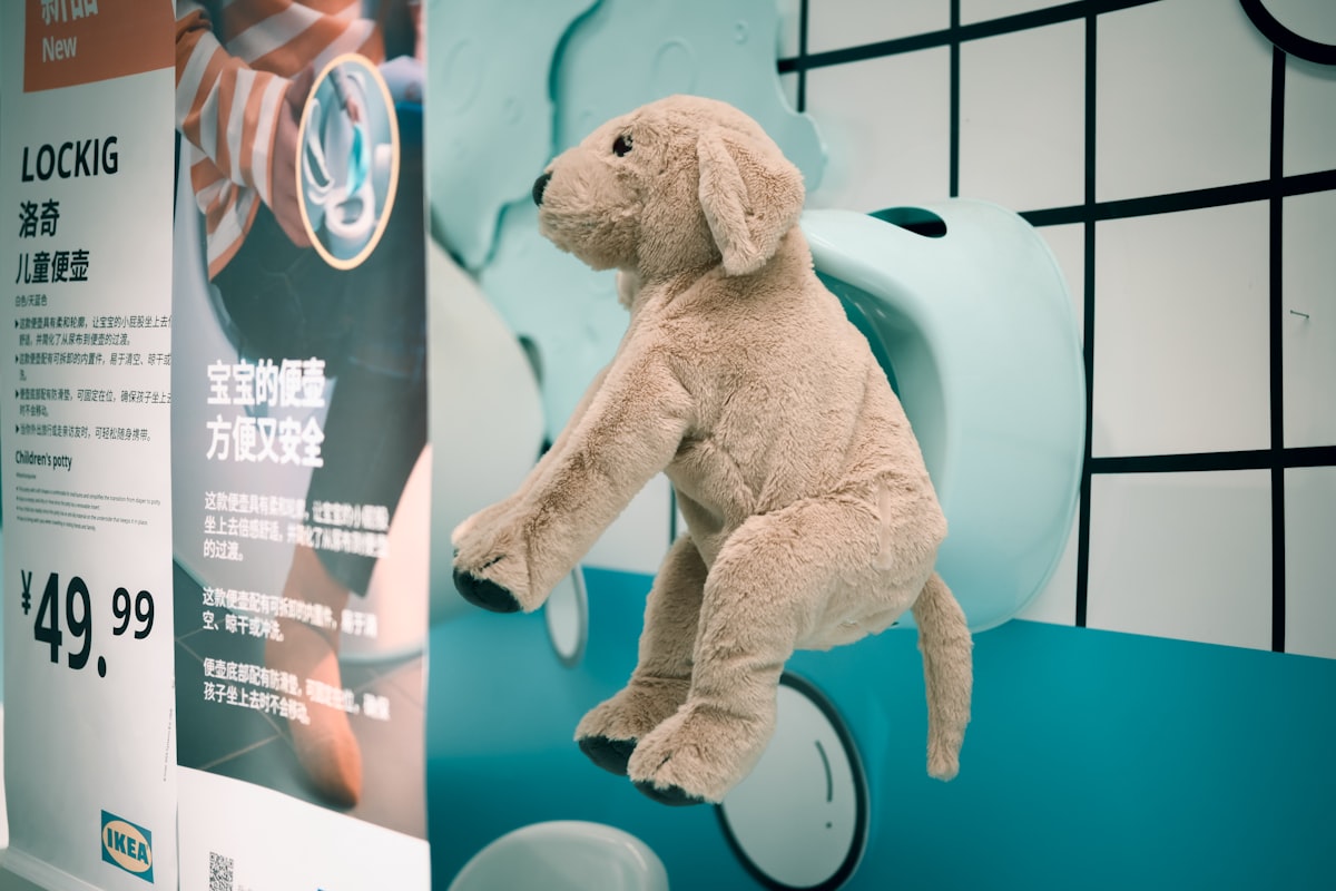 Plush dog toy climbing on a display related to Unlocking the Fun of IKEA Kids' Beds