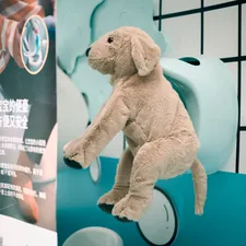 Plush dog toy climbing on a display related to Unlocking the Fun of IKEA Kids' Beds